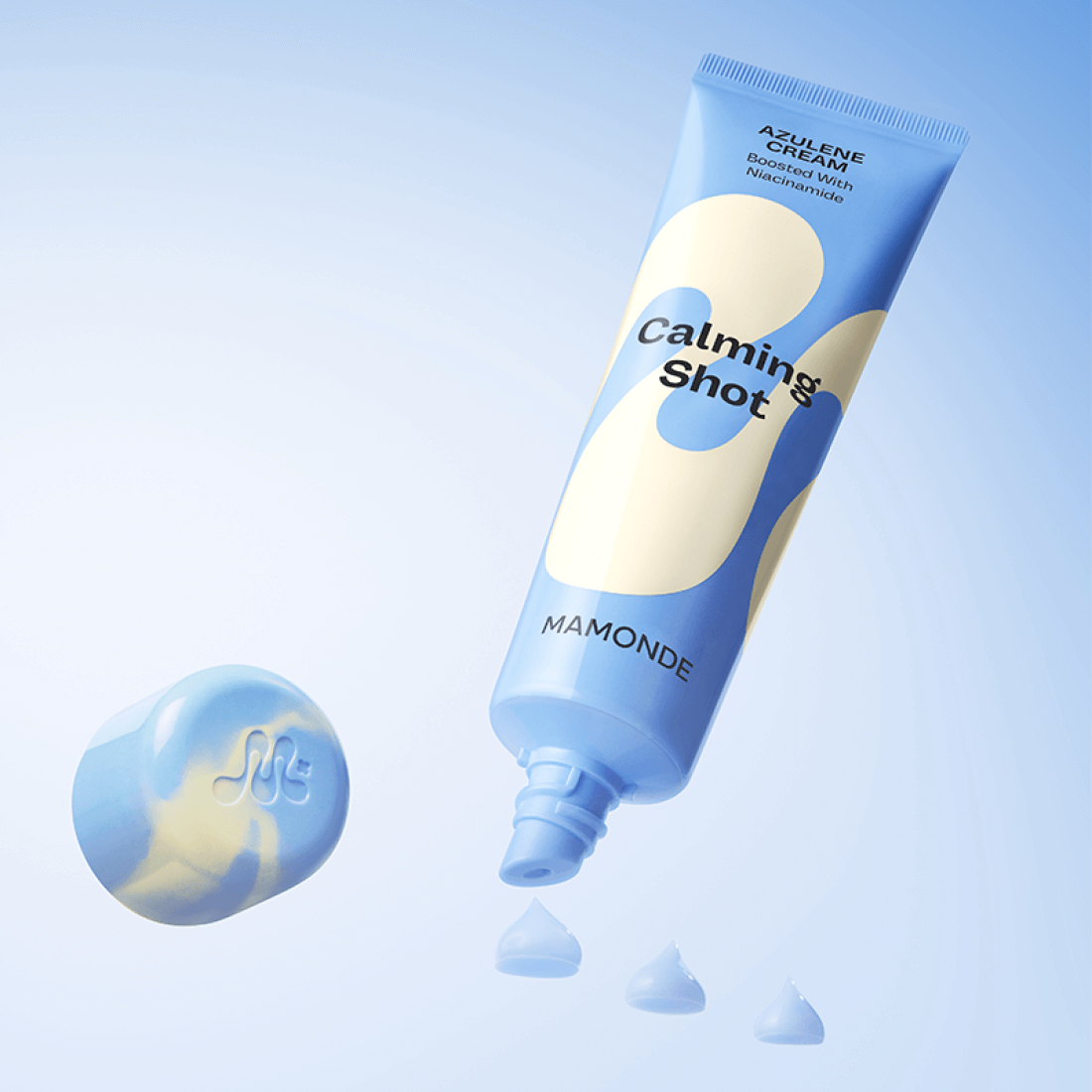 MAMONDE Calming Shot Azulene Cream 60ml tube with cream swatches on a blue background