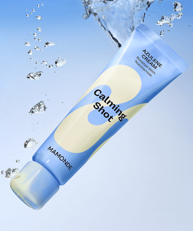 MAMONDE Calming Shot Azulene Cream 60ml tube with floating water droplets on a blue background