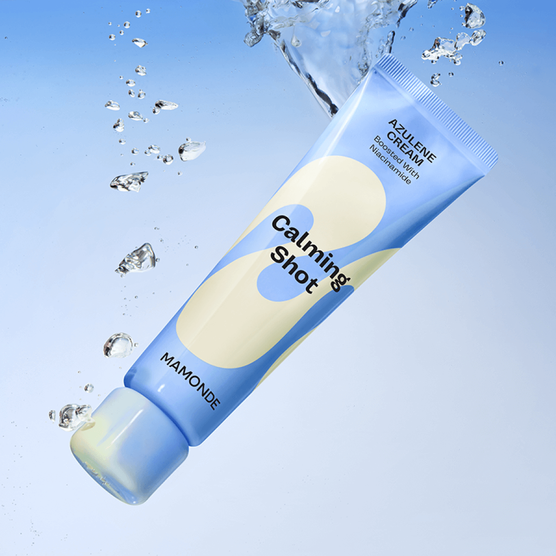 MAMONDE Calming Shot Azulene Cream 60ml tube with floating water droplets on a blue background