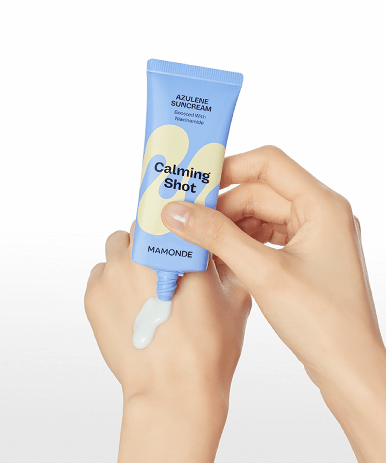 MAMONDE Calming Shot Azulene Sun Cream SPF50+PA++++ 35ml being applied on hand