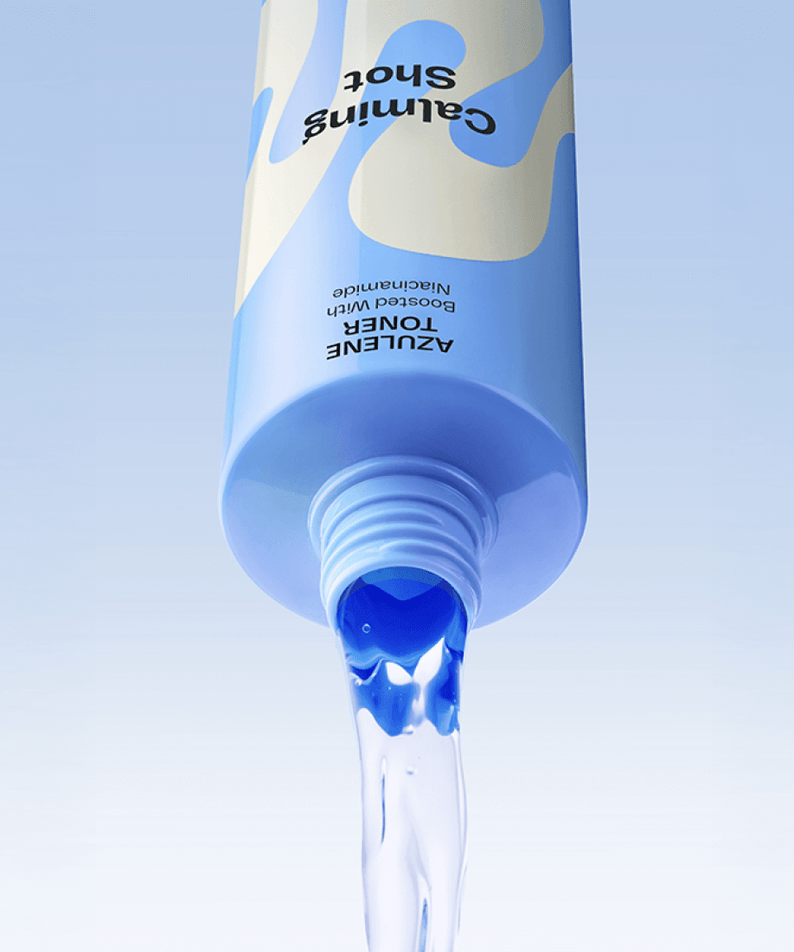 MAMONDE Calming Shot Azulene Toner 300ml bottle pouring blue liquid against light blue background.