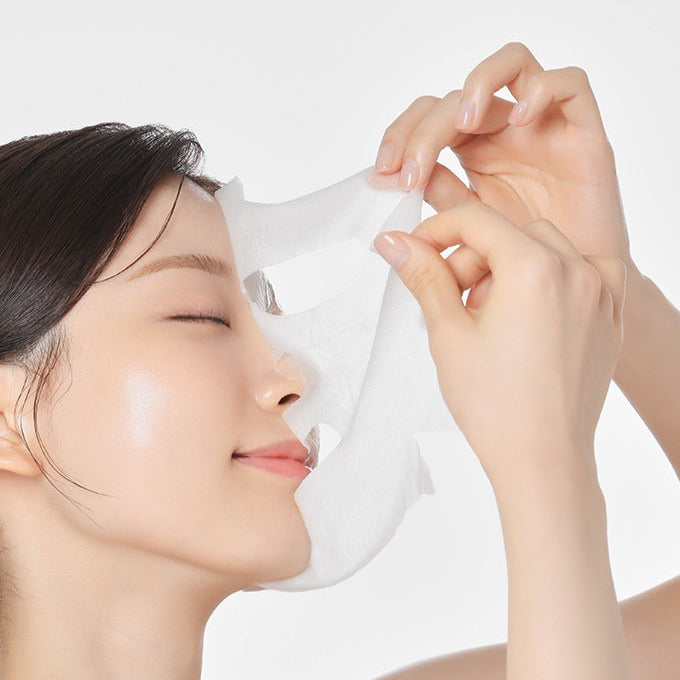 Woman using MAMONDE Flora Glow Rose Ampoule Mask Pack for skincare