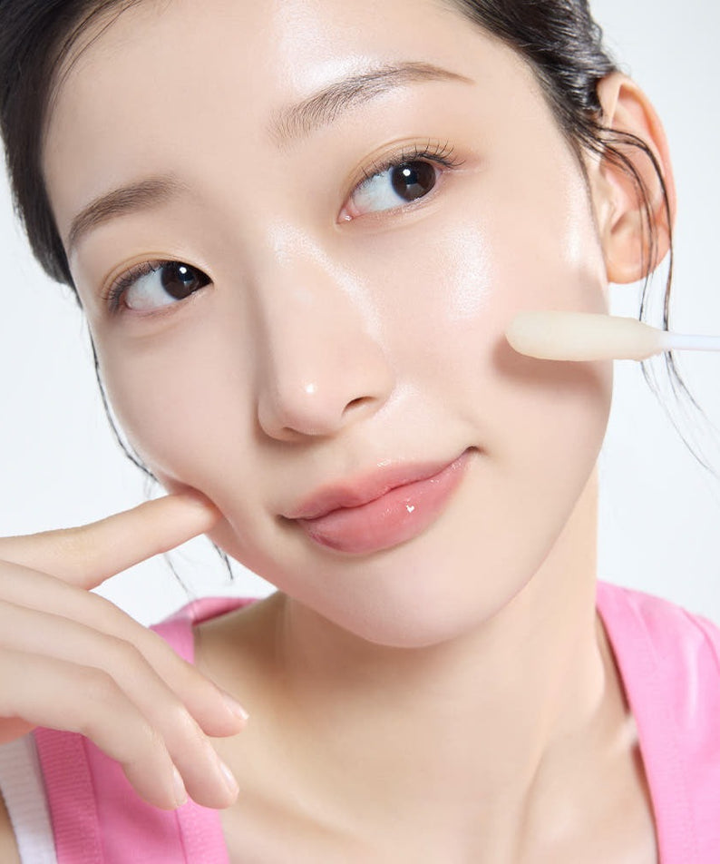 Woman applying MAMONDE Flora Glow Rose Ball Mask 3.5ml for radiant skin.