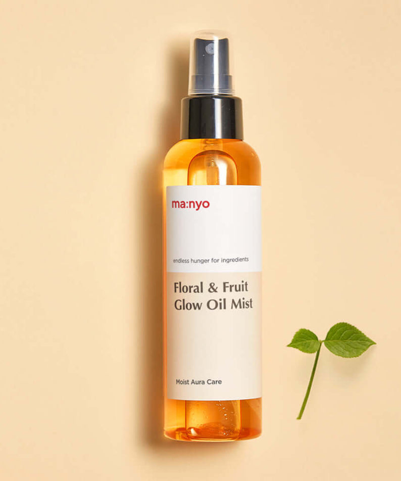 MANYO Floral & Fruit Glow Oil Mist 150ml bottle on neutral background with leaf accent