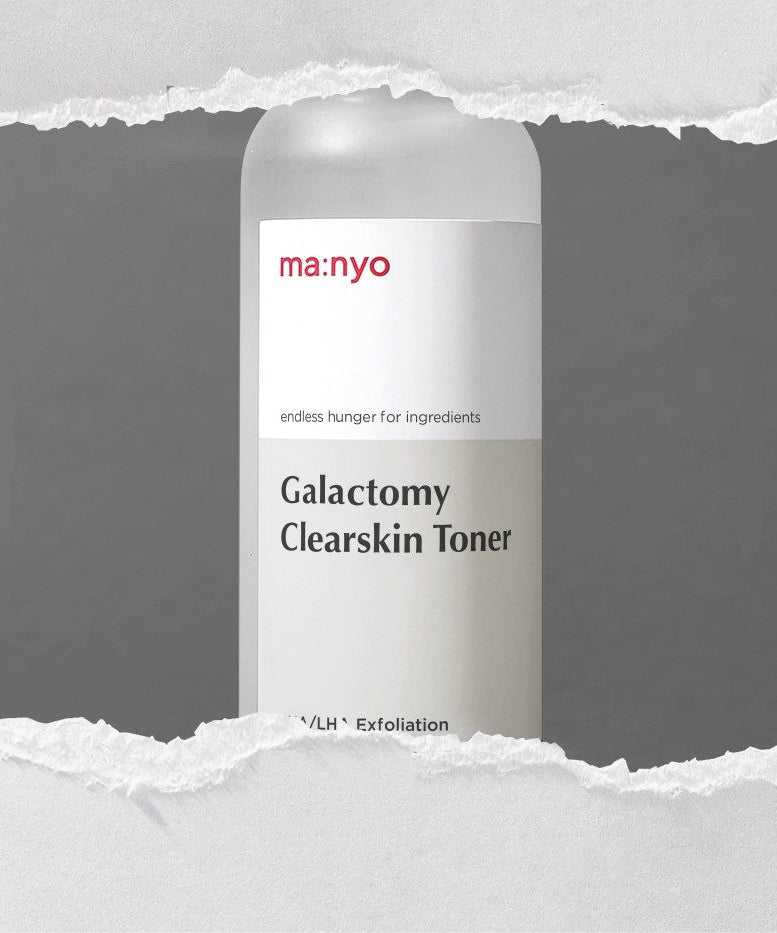 MA:NYO Galactomy Clearskin Toner 210ml bottle on torn paper background.