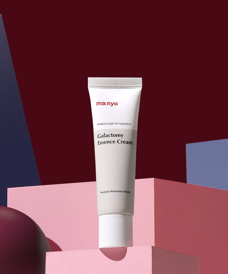MA:NYO Galactomy Essence Cream 50ml displayed on a colorful geometric background