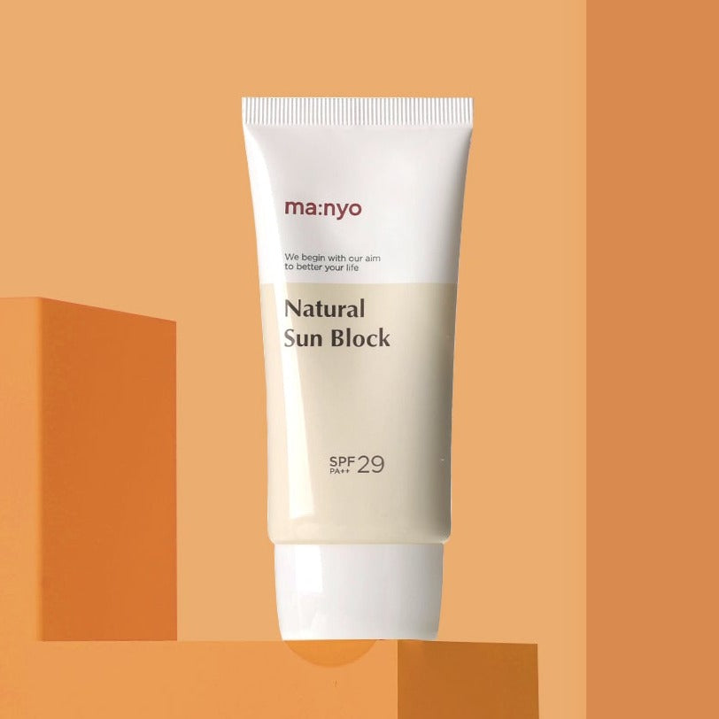 MA:NYO Natural Sun Block SPF 29 50ml sunscreen tube on orange background