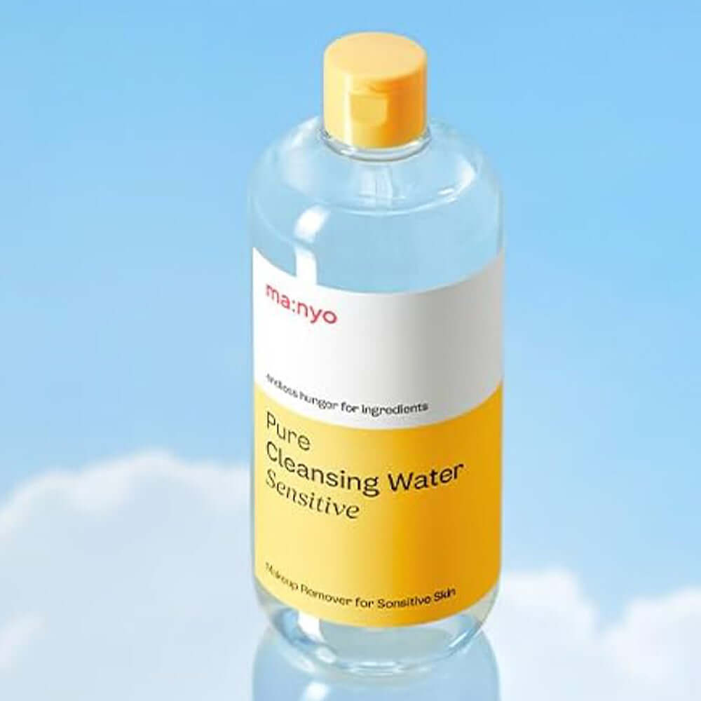 Bottle of MANYO Pore Cleansing Water Sensitive 500ml against a blue sky backdrop
