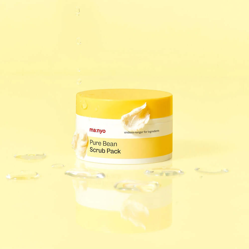 MANYO Pure Bean Scrub Pack 100ml jar with creamy texture on a yellow background