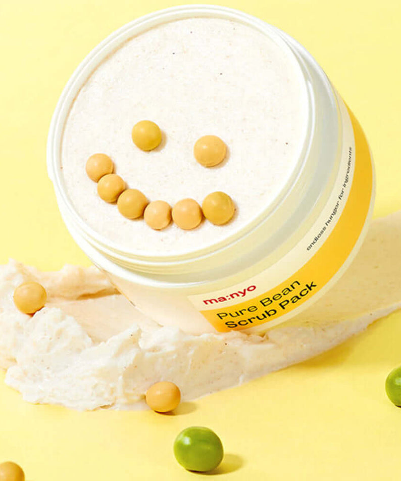 MANYO Pure Bean Scrub Pack 100ml with smiling face design on pastel yellow background