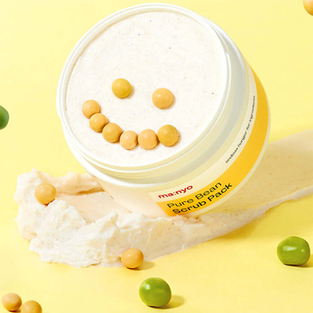 MANYO Pure Bean Scrub Pack 100ml with smiling face design on pastel yellow background