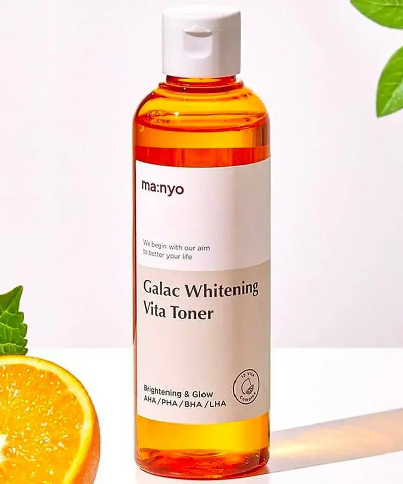 MA:NYO V Galac Whitening Vita Toner 210ml bottle with citrus and leaf accents, emphasizing brightening and glow properties.