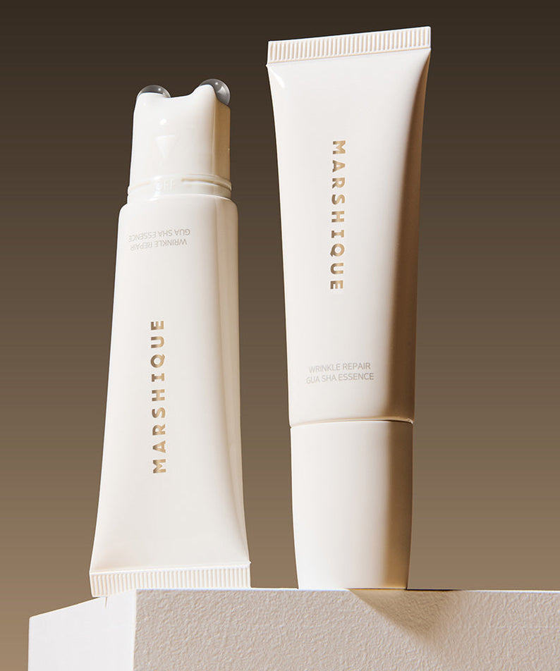 MARSHIQUE Wrinkle Repair Guasha Essence 45ml product display with two elegant bottles against a gradient background.