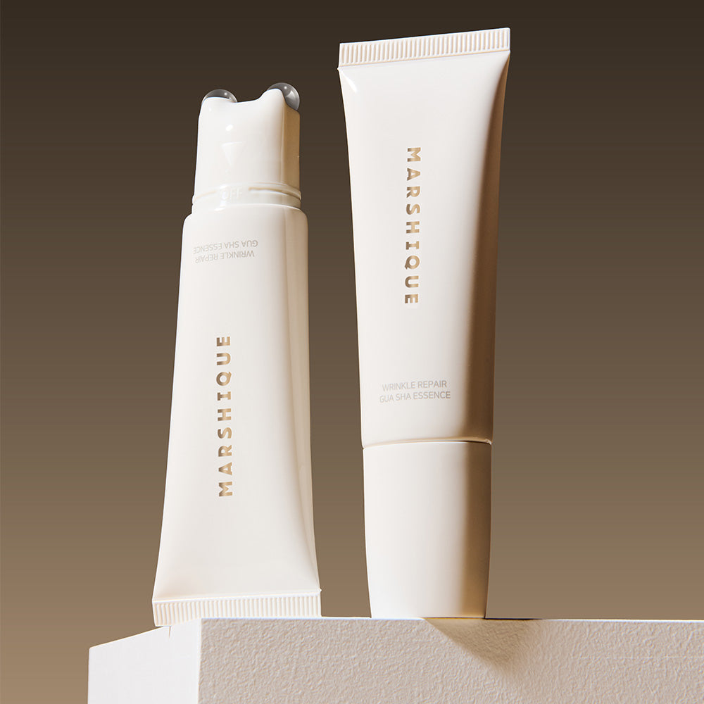 MARSHIQUE Wrinkle Repair Guasha Essence 45ml product display with two elegant bottles against a gradient background.