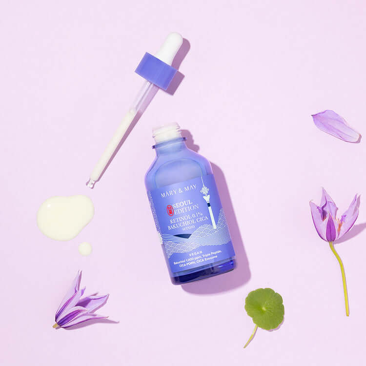 MARY & MAY Retinol 0.1% Bakuchiol Cica Serum 80ml bottle with dropper on a pink background and flower accents.