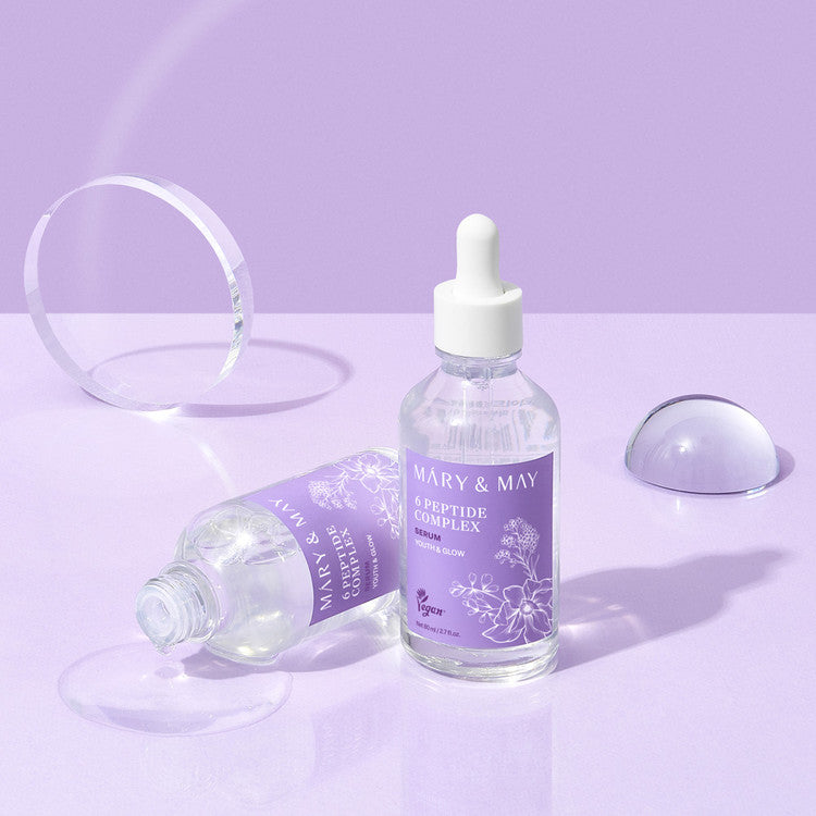 MARY&MAY 6 Peptide Complex Serum 80ml bottle on a purple surface, featuring peptide-rich formula for skincare.