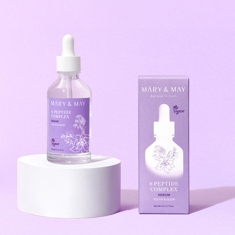 MARY&MAY 6 Peptide Complex Serum 80ml bottle and packaging on a pedestal against a purple background.