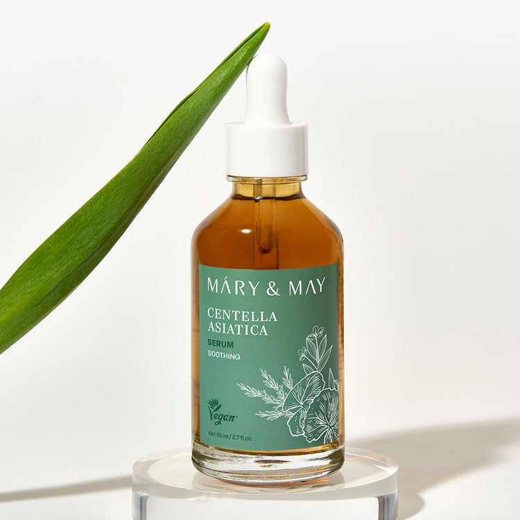 MARY&MAY Herbal Extract Serum 80ml bottle with a green label, surrounded by a leaf, highlighting the natural ingredients and vegan formula.