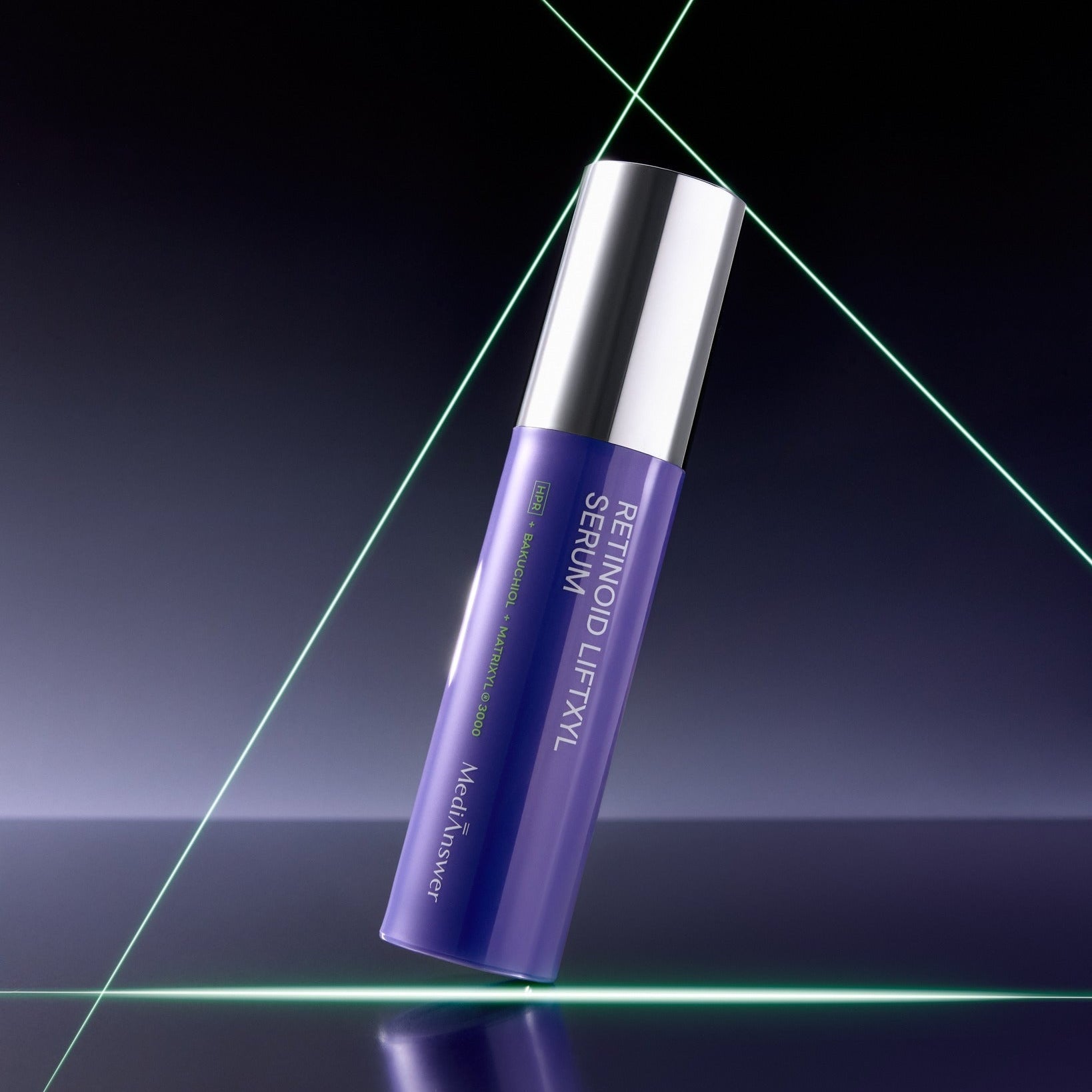 MEDIANSWER Retinoid Liftsil Serum 30ml in a sleek purple bottle with silver cap on a reflective surface.