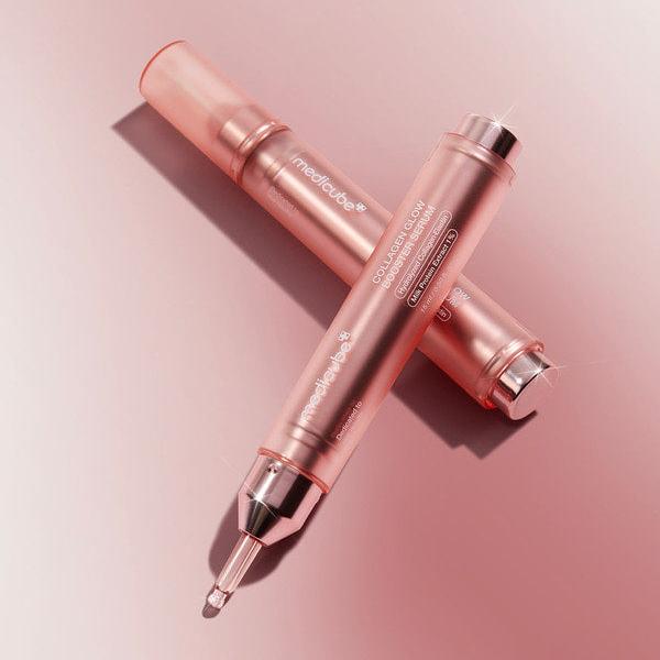 MEDICUBE Collagen Glow Booster Serum 15ml displayed on a pink surface, showcasing sleek packaging and dropper applicator.