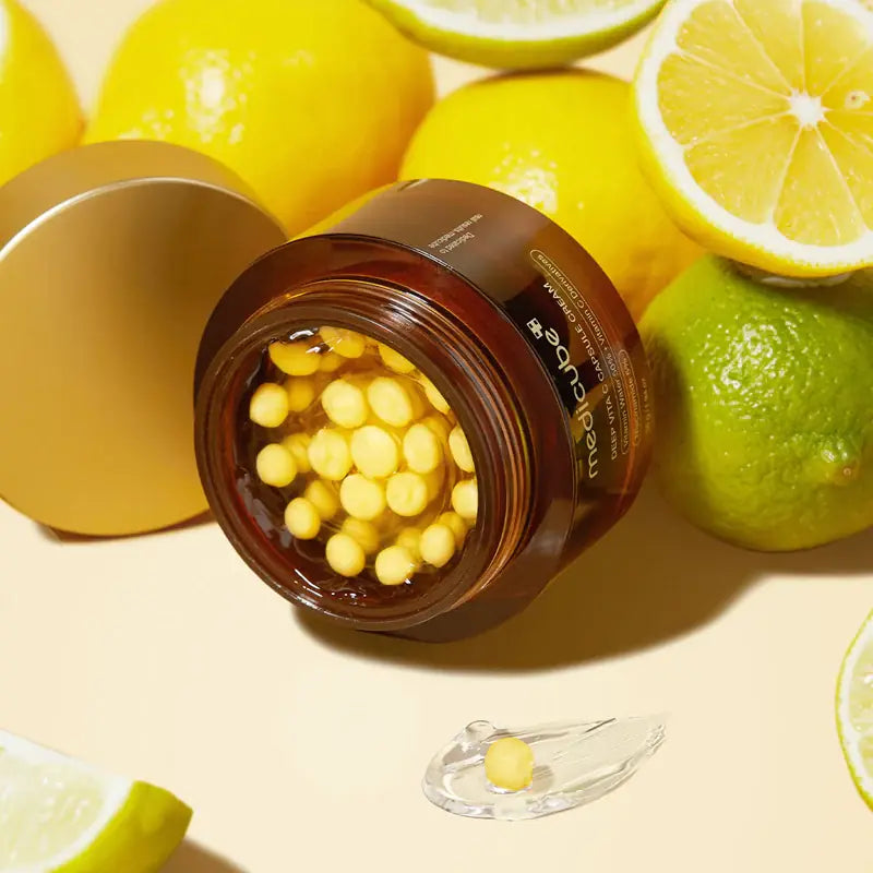 MEDICUBE Deep Vita C Capsule Cream 55g with citrus fruits, showing open jar and yellow capsules for brightening and skincare benefits.