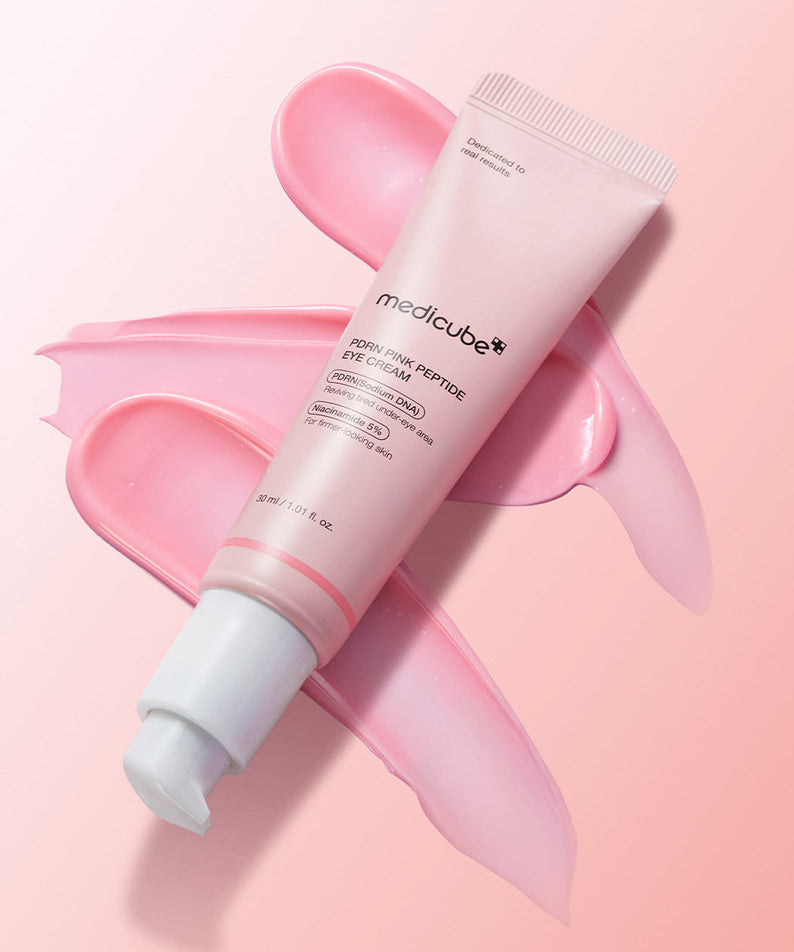 MEDICUBE PDRN Pink Peptide Eye Cream 30ml tube with pink cream smear background
