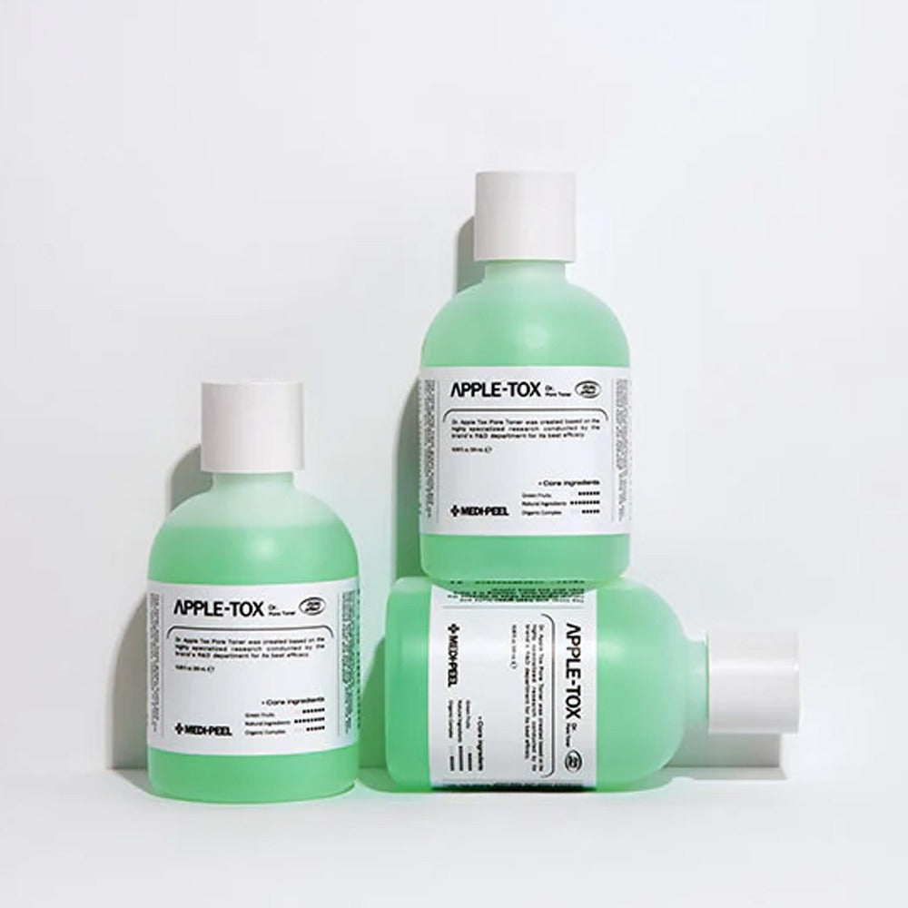 Three bottles of MEDIPEEL Dr.Apple Tox Pore Toner 500ml displayed on a white background