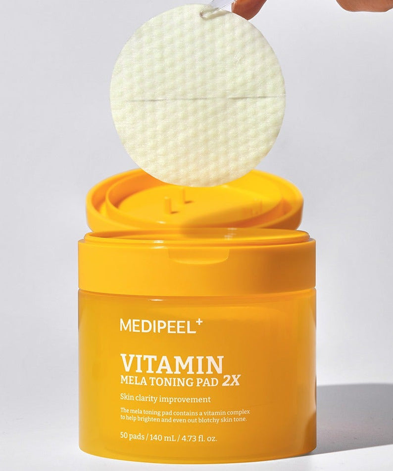 MEDIPEEL Vitamin Mela Toning Pads 2X 140ml 50sheets in yellow packaging with a pad being lifted out of the container.
