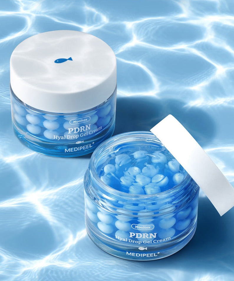 MEDIPEEL Water Tox PDRN Hyal Drop Gel Cream 50g in blue jar on watery background