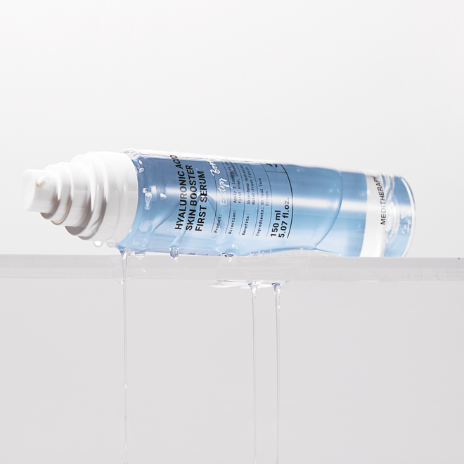 MEDITHERAPY Hyaluronic Acid Skin Booster First Serum 150ml bottle with white pump on display, showcasing its design and liquid texture.