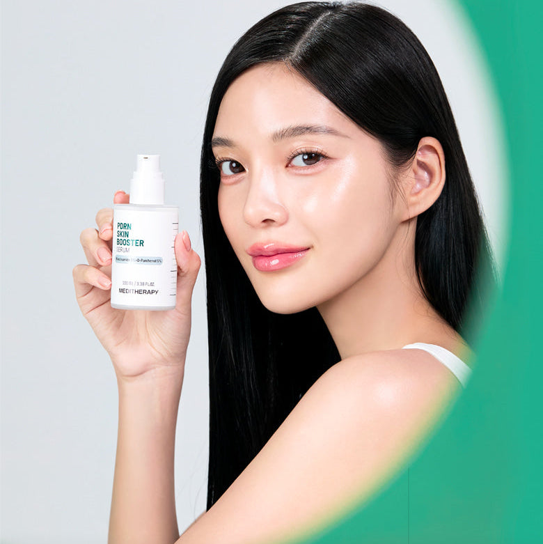 Woman holding MEDITHERAPY PDRN Skin Booster Serum 100ml, showcasing healthy skin benefits.