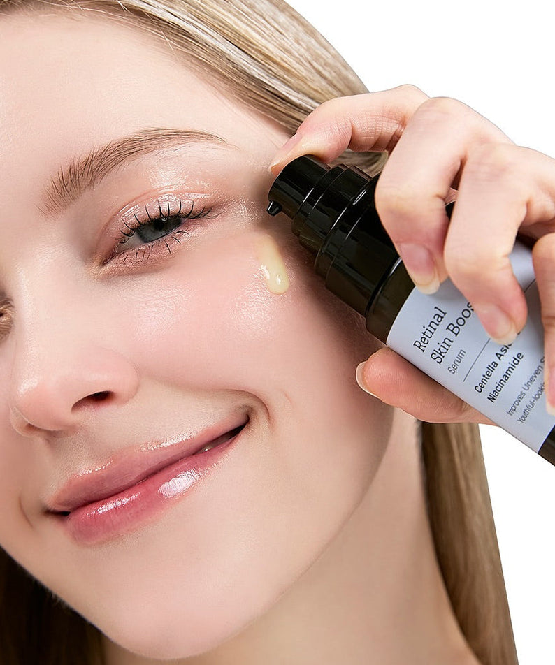 Woman applying MEDITHERAPY Retinal Skin Booster Serum 150ml for skin rejuvenation