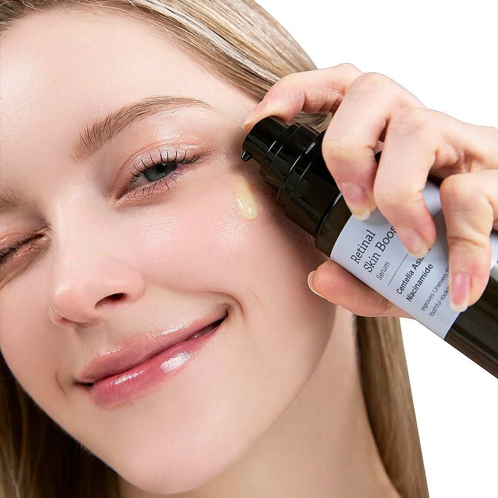 Woman applying MEDITHERAPY Retinal Skin Booster Serum 150ml for skin rejuvenation