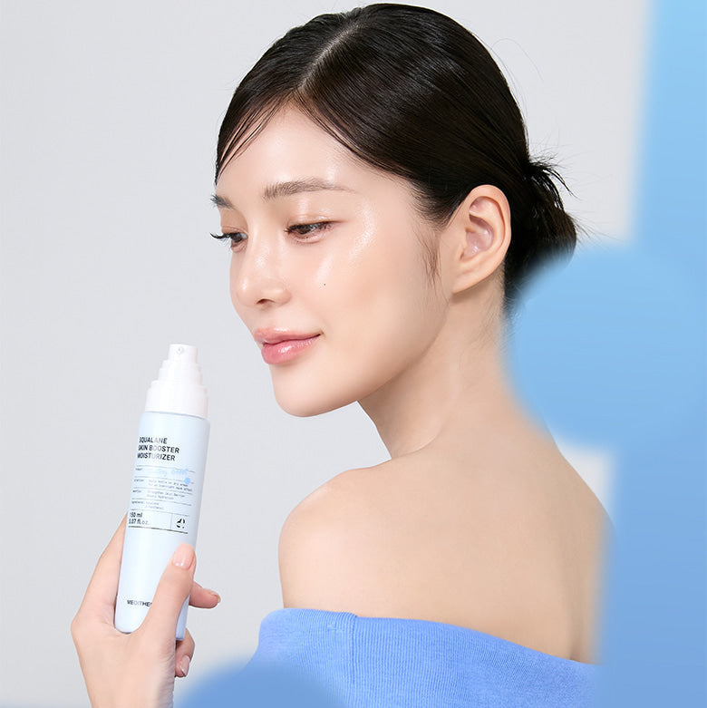 Woman holding MEDITHERAPY Squalane Skin Booster Moisturizer 150ml bottle, showcasing smooth and hydrated skin.