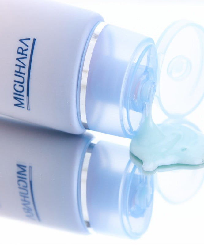 MIGUHARA Aqua Refresh Relief Peel Off Mask Pack 60ml tube with product spilling out on a reflective surface.