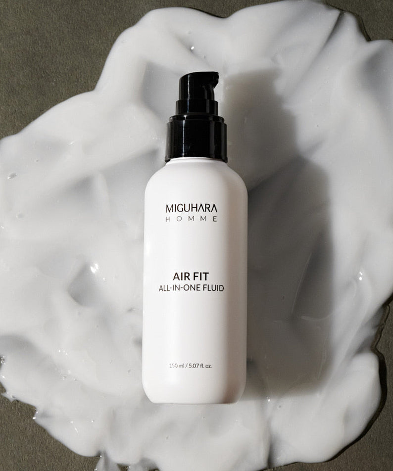 MIGUHARA Homme Air Fit All In One Fluid 150ml bottle on white foam background, Korean men's skincare by Gentleman Korea