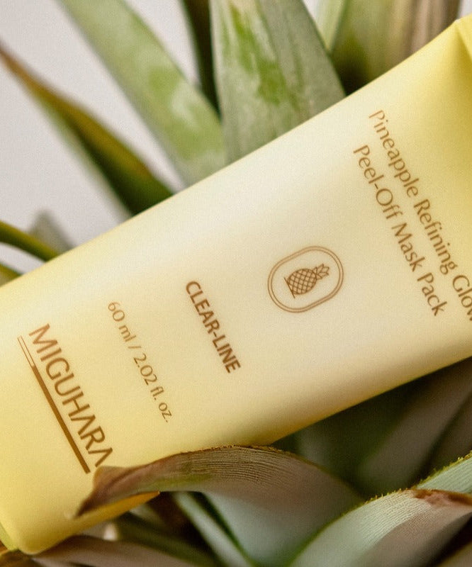 MIGUHARA Pineapple Refining Glow Peel Off Mask Pack 60ml with fresh pineapple background, highlighting skincare product features