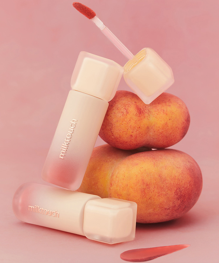 MILK TOUCH Spread Fit Blur Tint with peach backdrop and open applicator