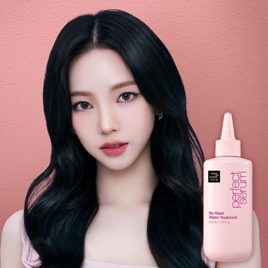 Woman with MISE EN SCENE Perfect No Wash Water Treatment 215ml against a coral background
