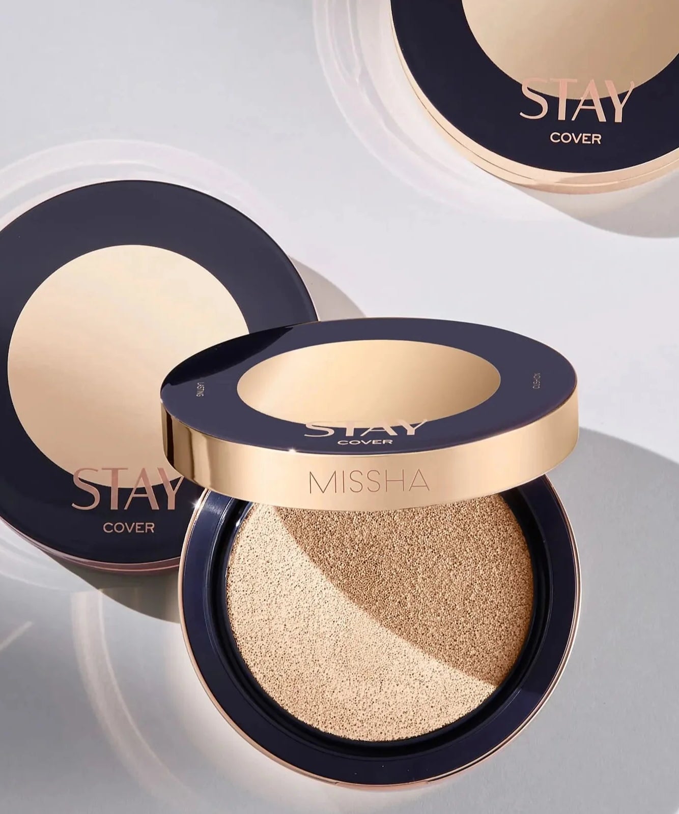 Open MISSHA STAY CUSHION showing smooth applicator and lid with STAY branding.