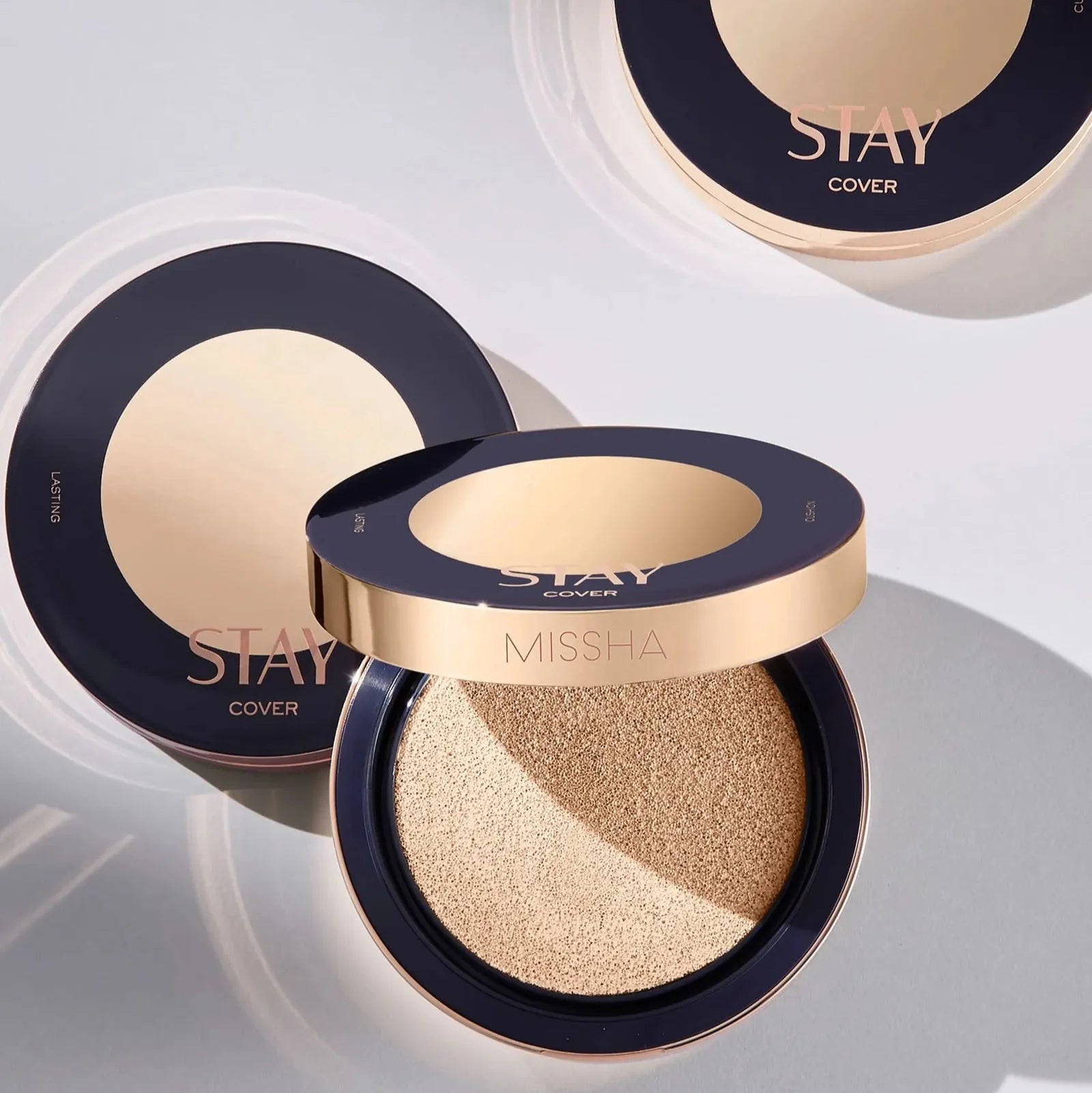 Open MISSHA STAY CUSHION showing smooth applicator and lid with STAY branding.