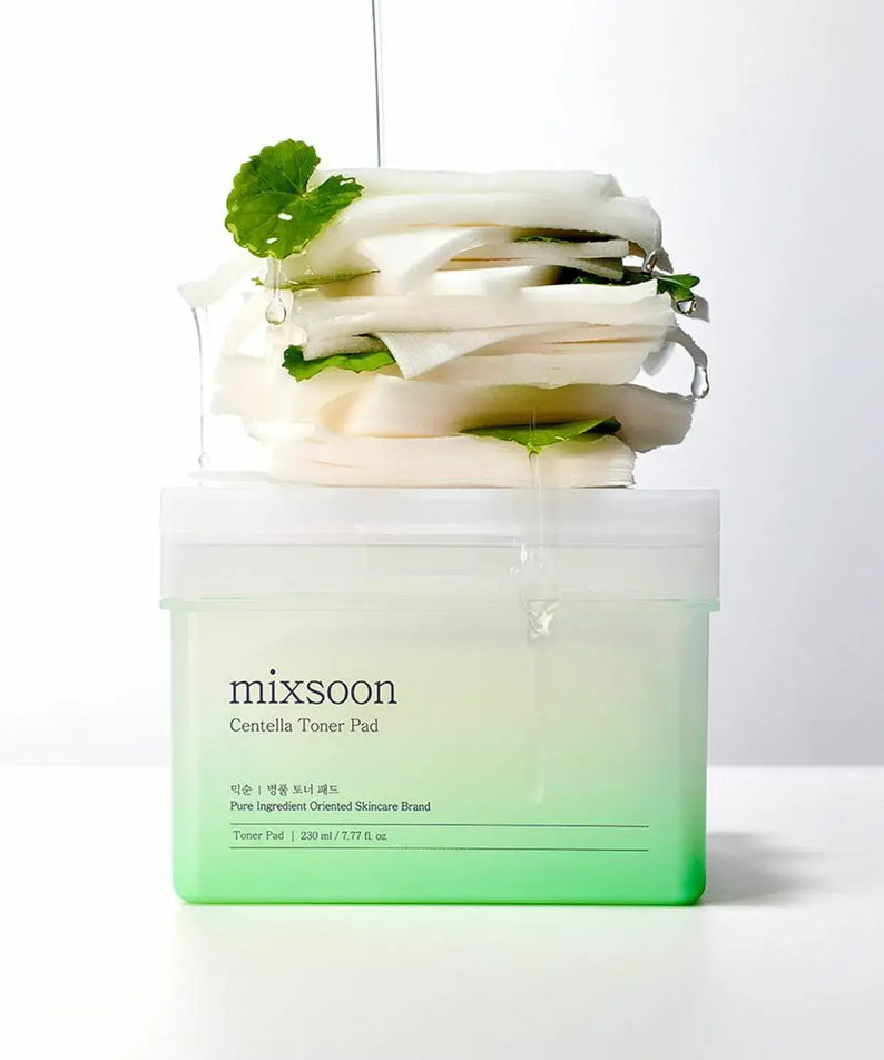 MIXSOON Bottle Grass Toner Pad stacked with cotton pads, infused with natural extracts for skin care.