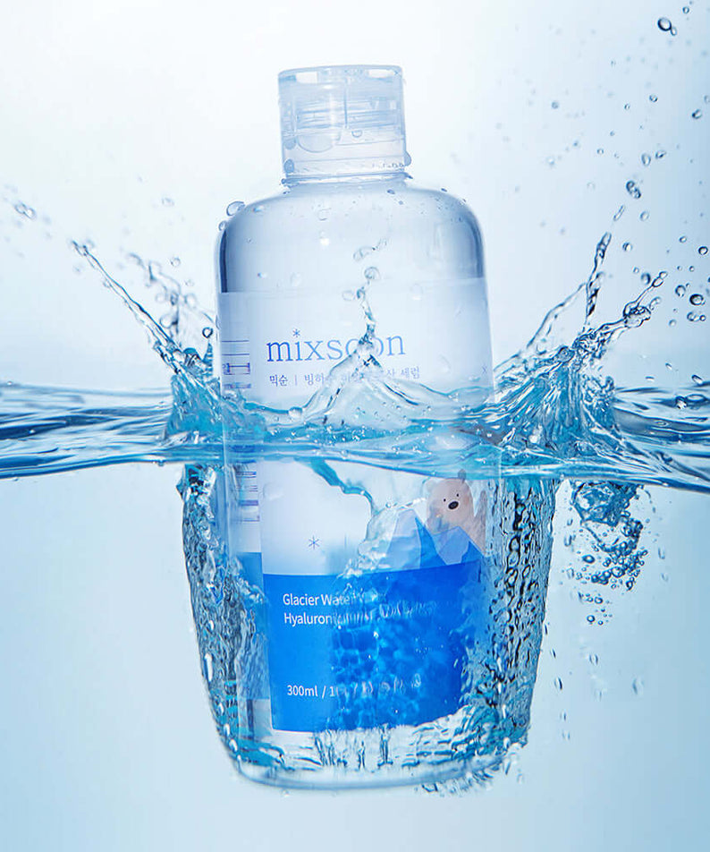 MIXSOON Glacier Water Hyaluronic Acid Serum 300ml bottle splashing in water, highlighting hydration and skincare benefits.