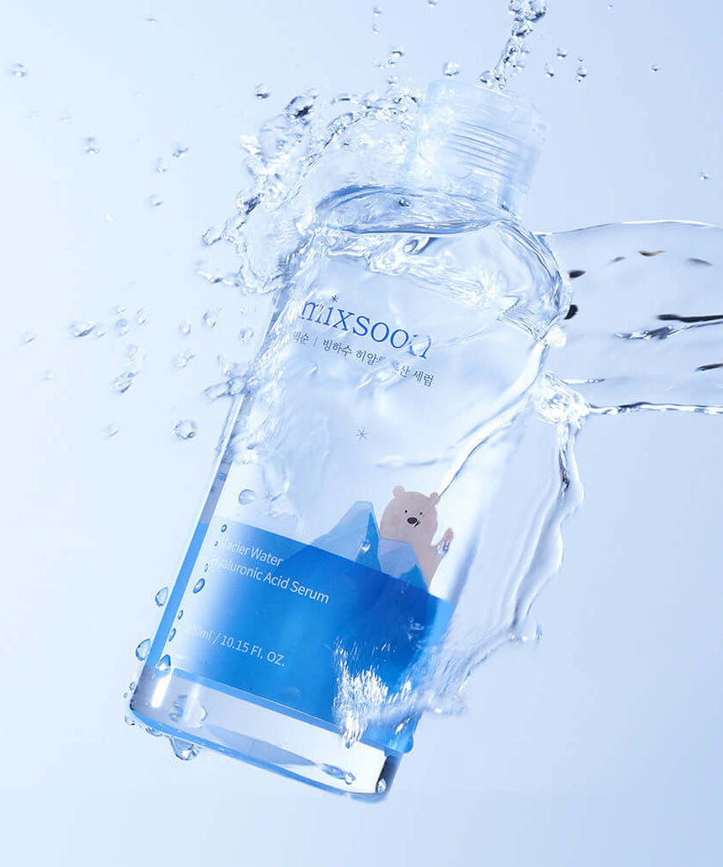 MIXSOON Glacier Water Hyaluronic Acid Serum 300ml bottle with water splash, showcasing hydrating properties on a light blue background.