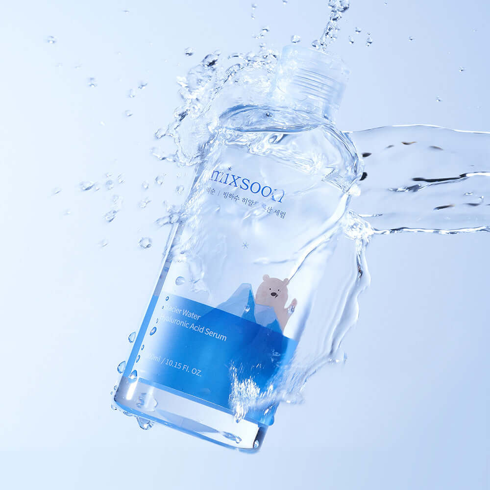 MIXSOON Glacier Water Hyaluronic Acid Serum 300ml bottle with water splash, showcasing hydrating properties on a light blue background.