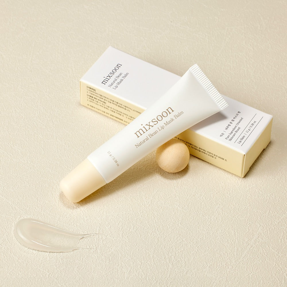 MIXSOON Natural Bean Lip Mask bean tube with packaging and product smear on beige background