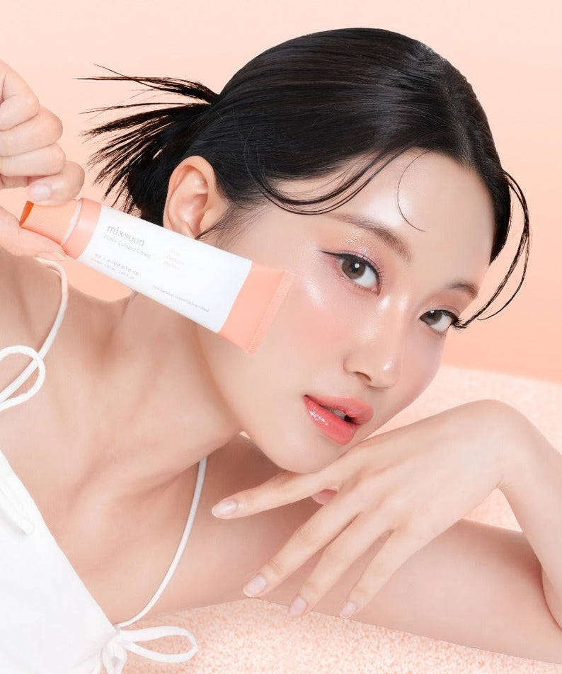 Woman holding MIXSOON PDRN Collagen Cream 50ml, showcasing glowing skin with the beauty product.