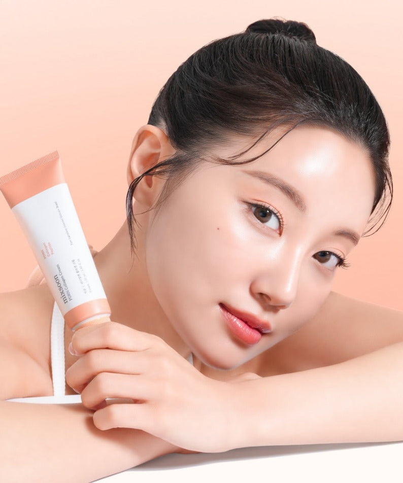 Woman holding MIXSOON PDRN Collagen Cream 50ml against a gradient background