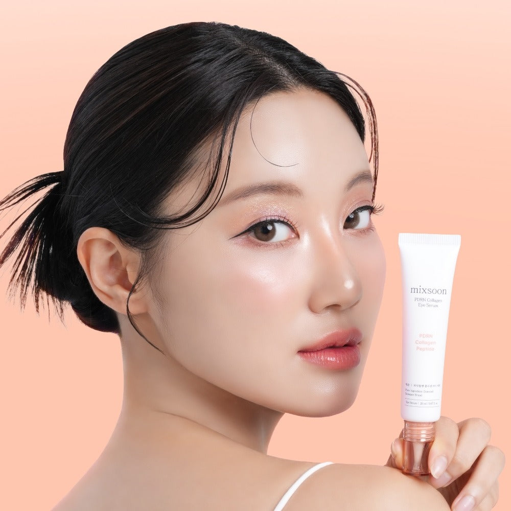 Woman holding MIXSOON PDRN Collagen Eye Serum 20ml against a peach background