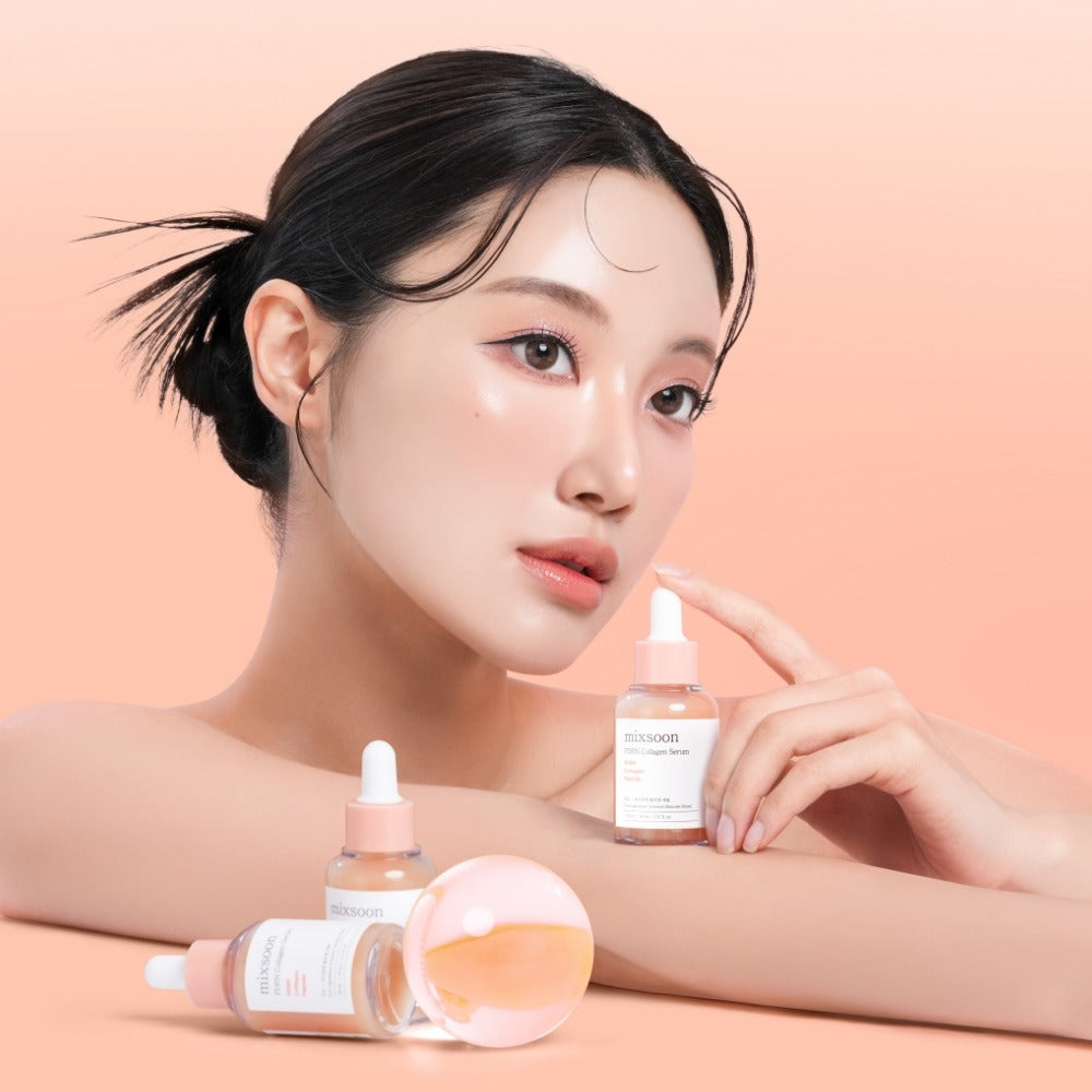 Woman holding MIXSOON PDRN Collagen Serum 30ml with additional bottles displayed against a peach background.